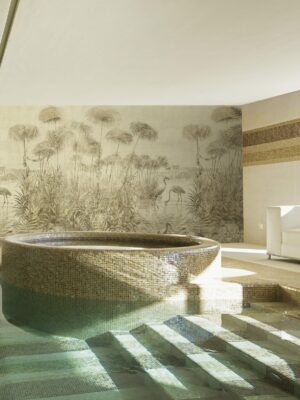 Indoor pool of private villa with wetlands mural